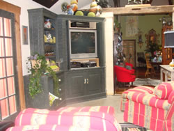 Midnight green crackle wall unit. The same finish ties together two rooms.