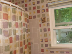 Graphics match shower curtain