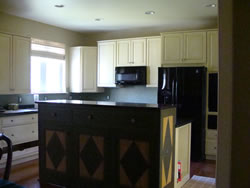 Glazed cabinets with complementary painted walls